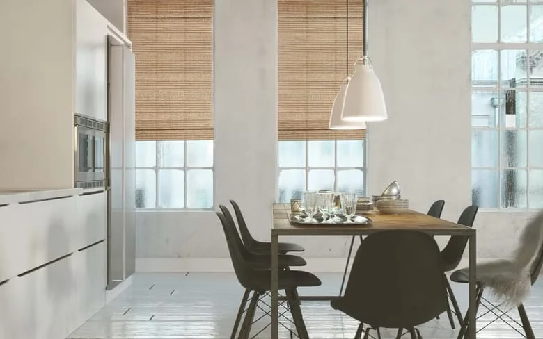 Natural woven Universal shades in a bright kitchen and dining space